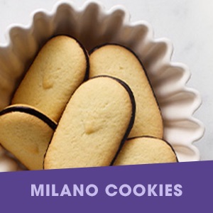 Chocolate and crisp Milano sandwich cookies in a bowl